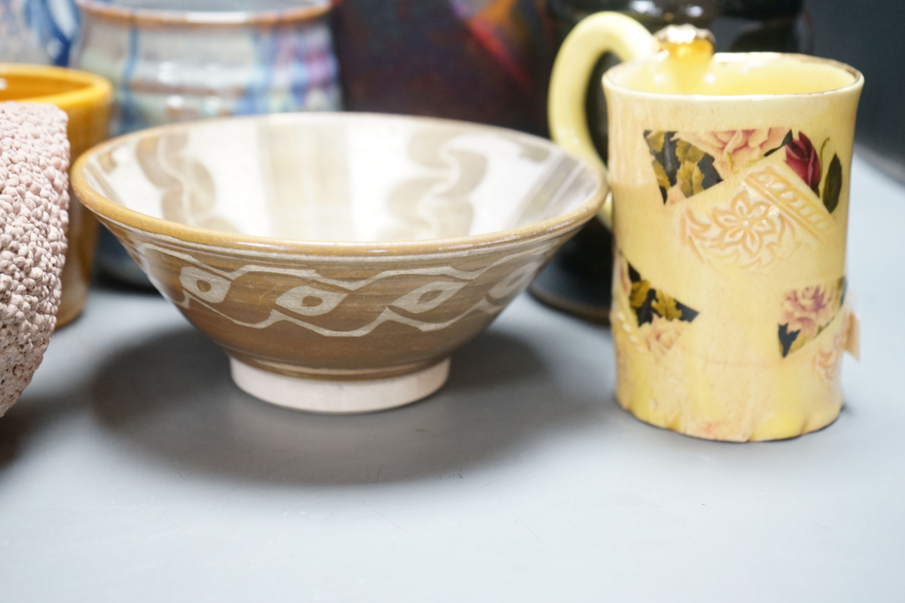 A group of studio pottery jugs, mugs, and other vessels to include –